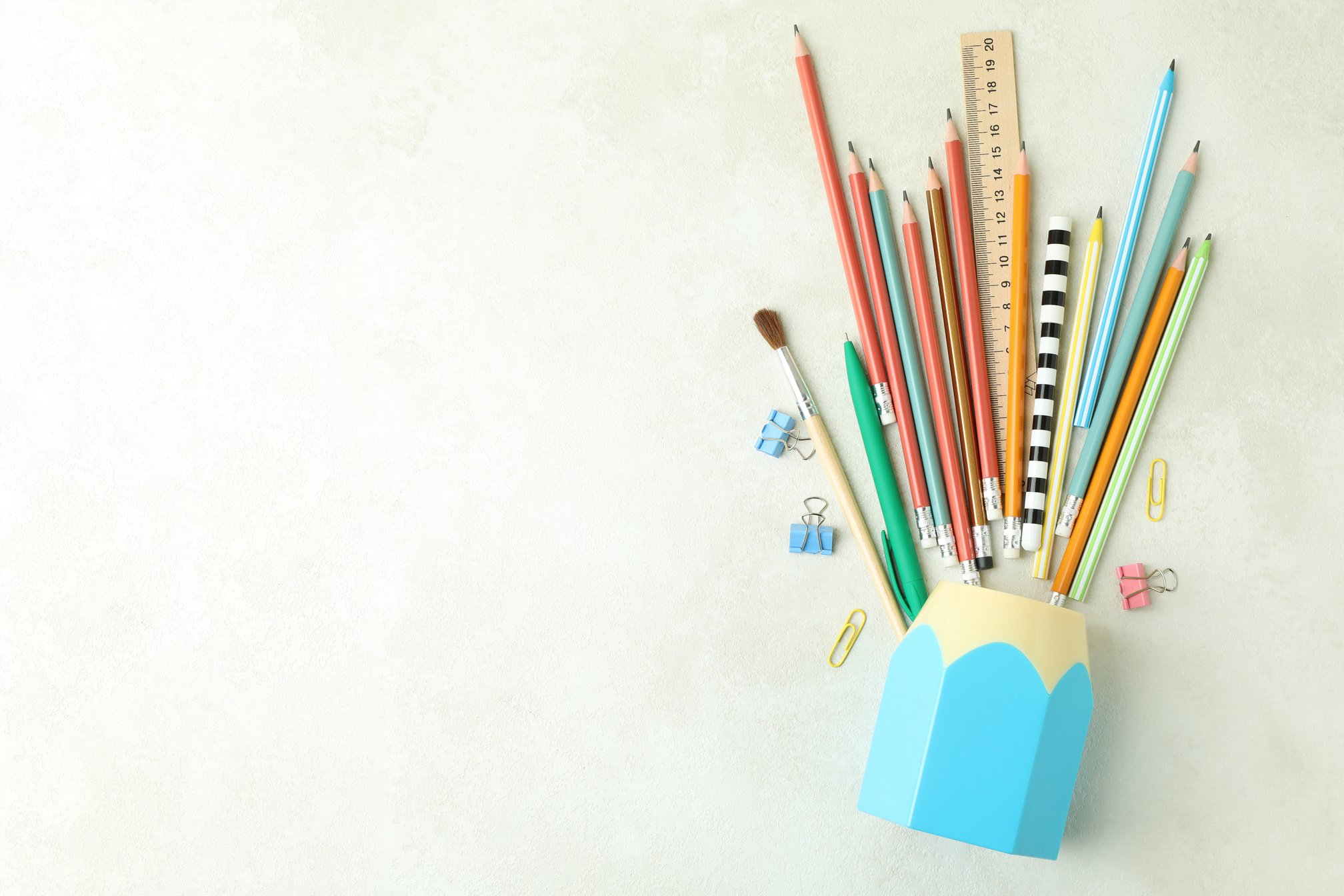 Holder with Stationery on White Textured Table